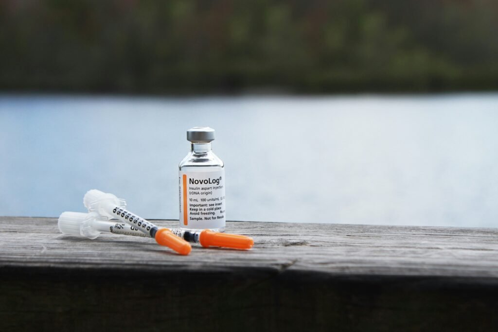 orange and white plastic bottle on brown wooden table